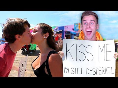 Single Guy Holds Up KISS ME Sign And Gets LUCKY From Strangers thumbnail